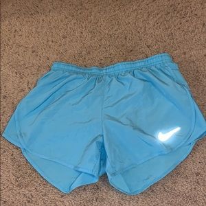 Teal Nike running shorts